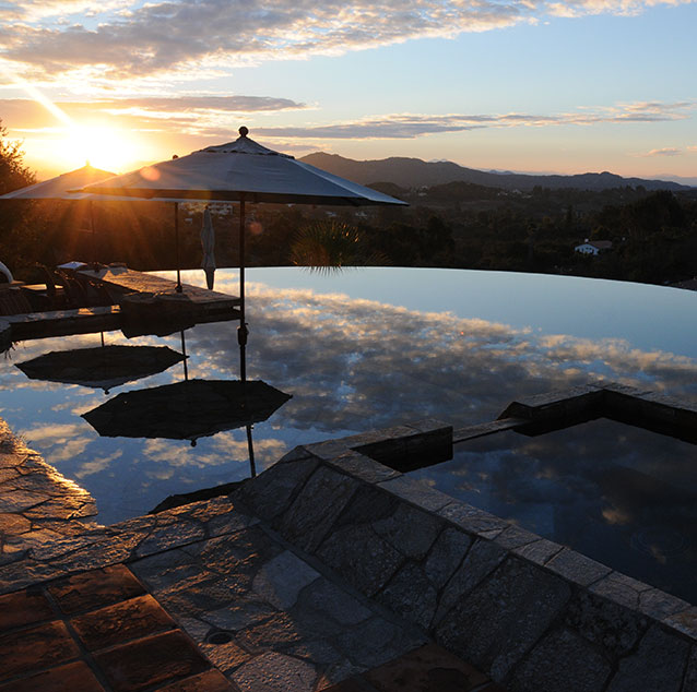 Infintity edge pool with sunset reflection
