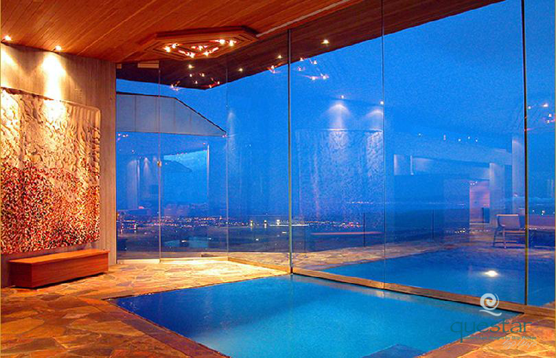 Indoor/Outdoor pool divided by glass wall