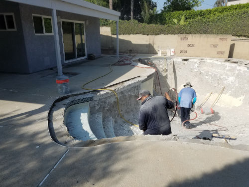 Work begins! Pool is drained and now pool is being prepped, led by our Foreman, Gabriel 